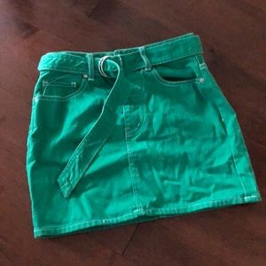 Green belted denim mini skirt